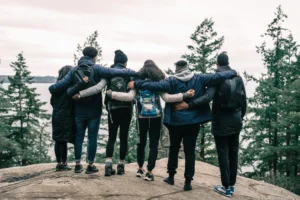 99+ Smooth Rizz Lines That Actually Work in 2025 4 A group of friends staying in front of mountains